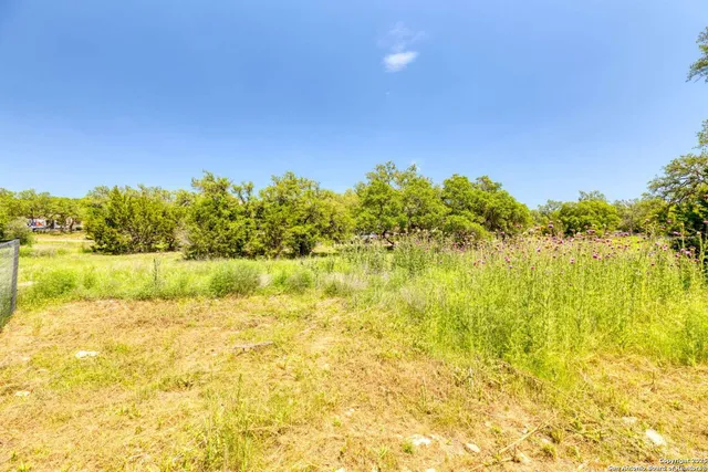 a view of kitchen with stainless steel appliances refrigerator stove microwave and cabinets