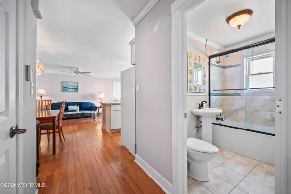 a bathroom with a toilet sink and tub