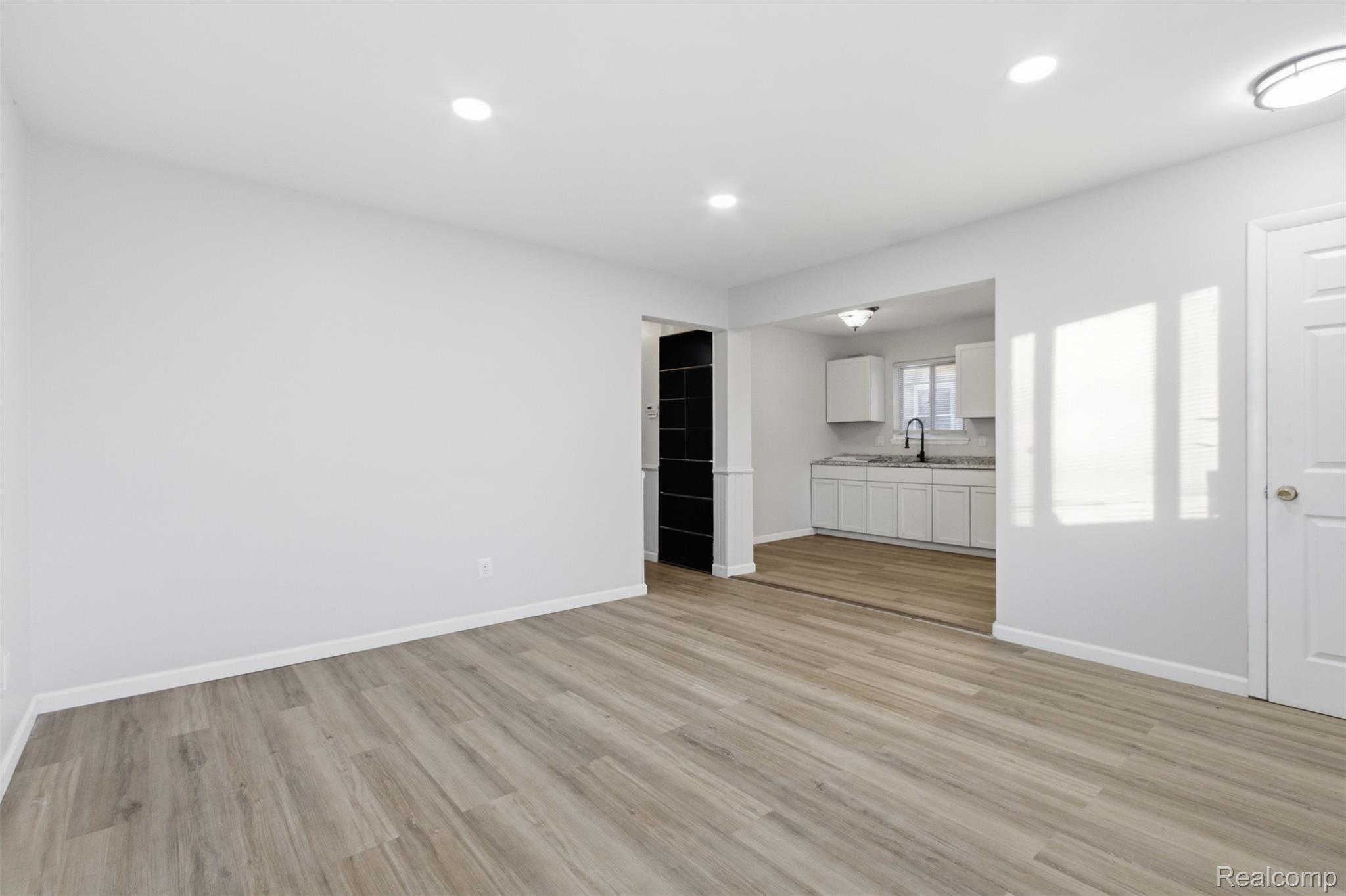 14731 Stephens Road Eastpointe, MI 48021 - Photo 5 of 15 Unfurnished living room with light wood-style flooring and recessed lighting