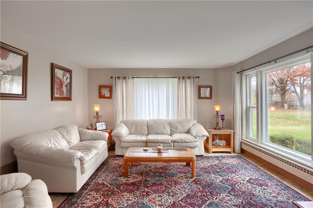 212 Tulagi Way New Castle, PA 16105 - Photo 11 of 30 a living room with furniture and a large window