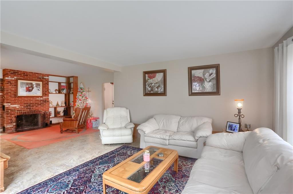 212 Tulagi Way New Castle, PA 16105 - Photo 13 of 30 a living room with furniture and a fireplace