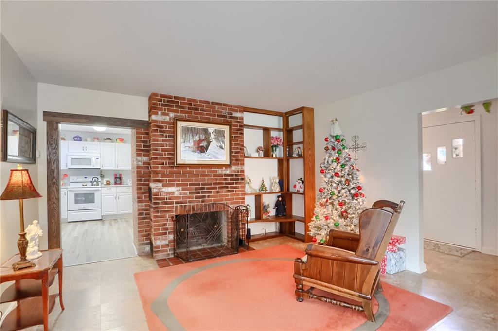 212 Tulagi Way New Castle, PA 16105 - Photo 14 of 30 a living room with furniture and a fireplace