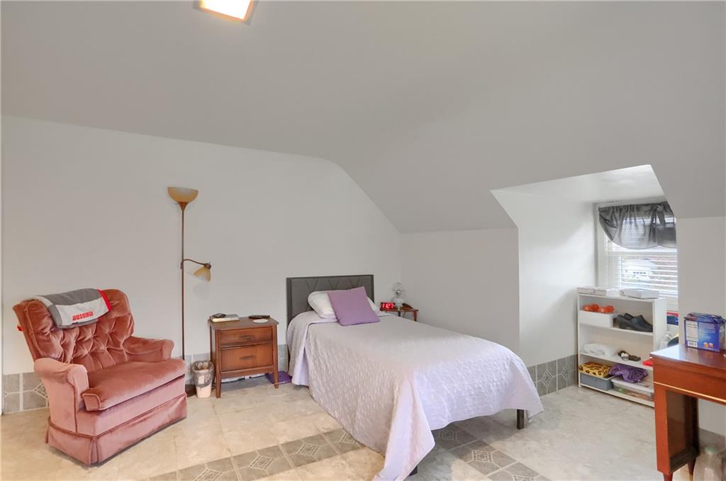 212 Tulagi Way New Castle, PA 16105 - Photo 16 of 30 a bedroom with a bed and a couch