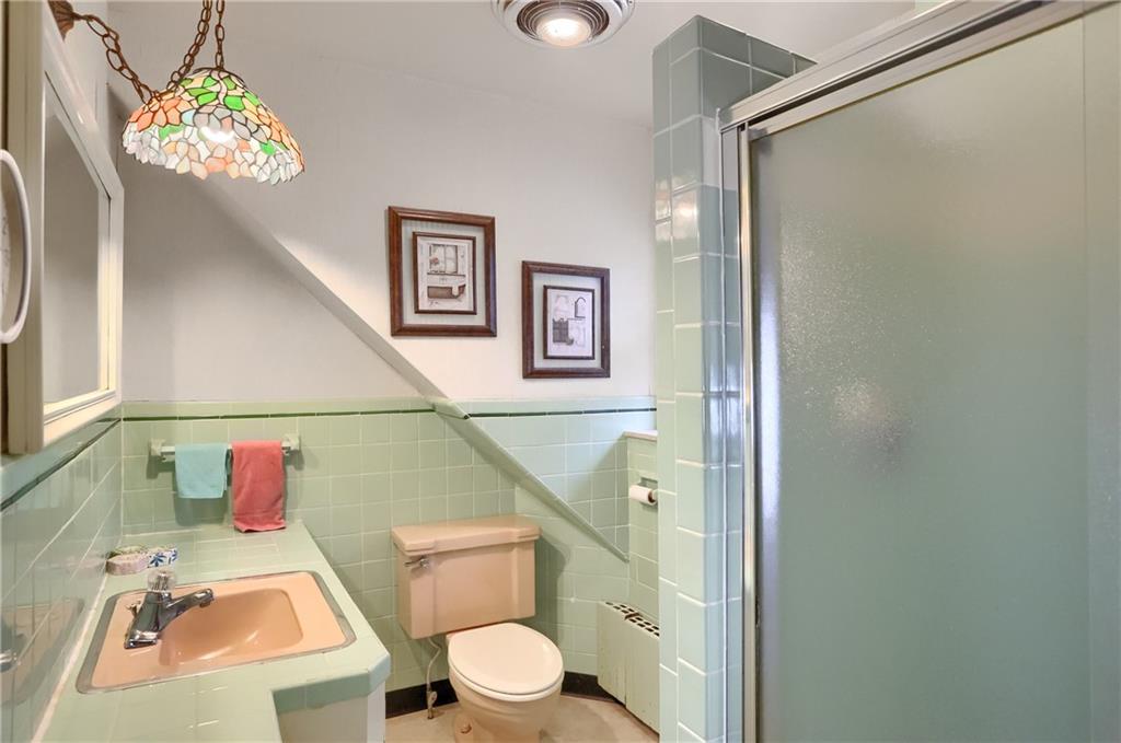 212 Tulagi Way New Castle, PA 16105 - Photo 22 of 30 a bathroom with a toilet sink vanity granite and shower