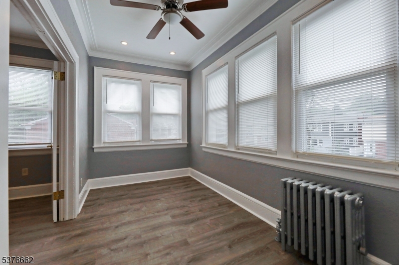 90 Norman Road Newark, NJ 07106 - Photo 11 of 31 a view of an empty room with wooden floor and a window