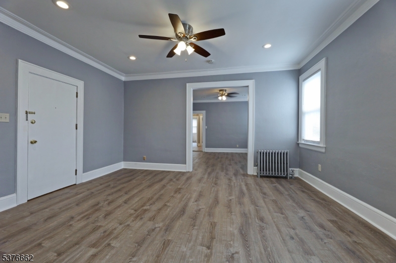 90 Norman Road Newark, NJ 07106 - Photo 13 of 31 wooden floor in an empty room with a window