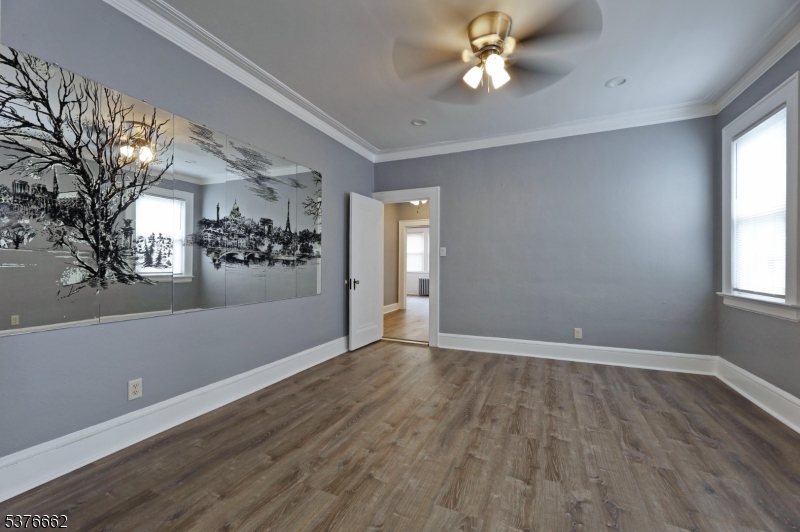 90 Norman Road Newark, NJ 07106 - Photo 15 of 31 wooden floor in an empty room with a window