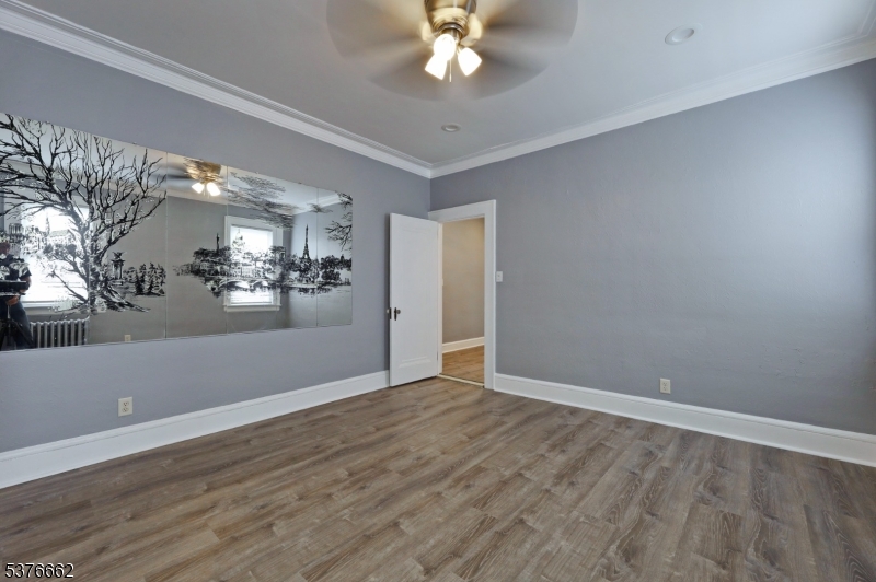 90 Norman Road Newark, NJ 07106 - Photo 16 of 31 wooden floor in an empty room with a window