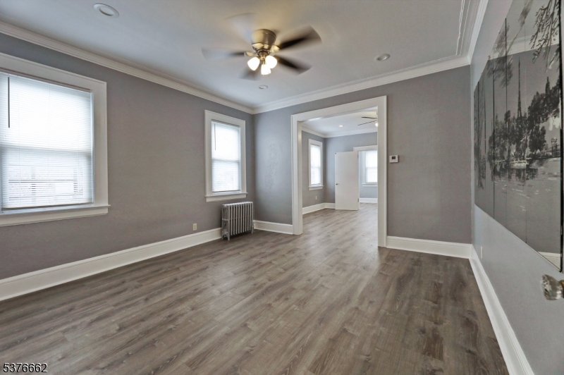 90 Norman Road Newark, NJ 07106 - Photo 18 of 31 wooden floor in an empty room with a window