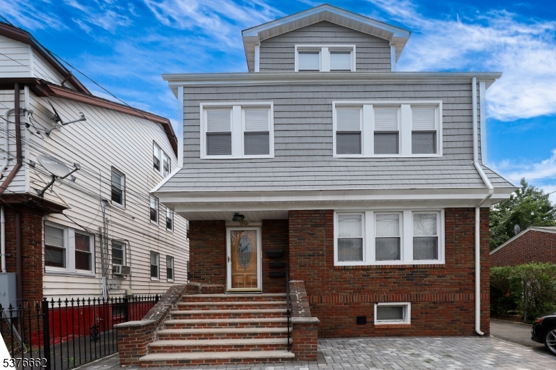 90 Norman Road Newark, NJ 07106 - Photo 2 of 31 a front view of a house with a yard