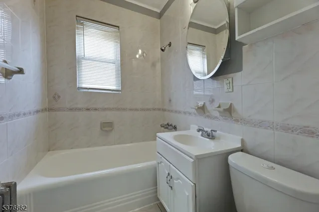a bathroom with a sink toilet and tub