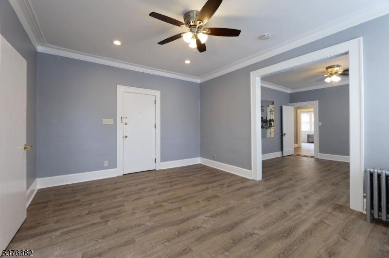 90 Norman Road Newark, NJ 07106 - Photo 8 of 31 a view of a livingroom with a ceiling fan & hardwood floor