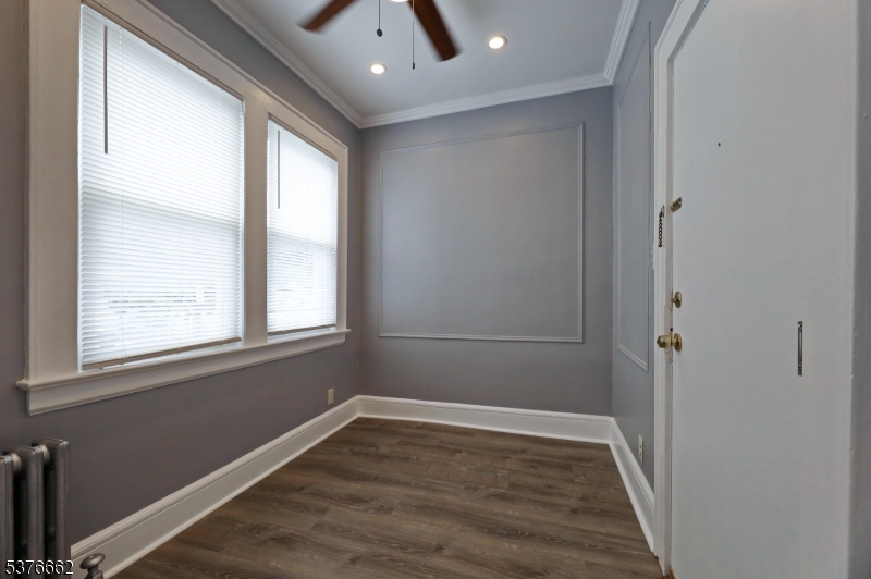 90 Norman Road Newark, NJ 07106 - Photo 10 of 31 a view of an empty room with wooden floor and a window