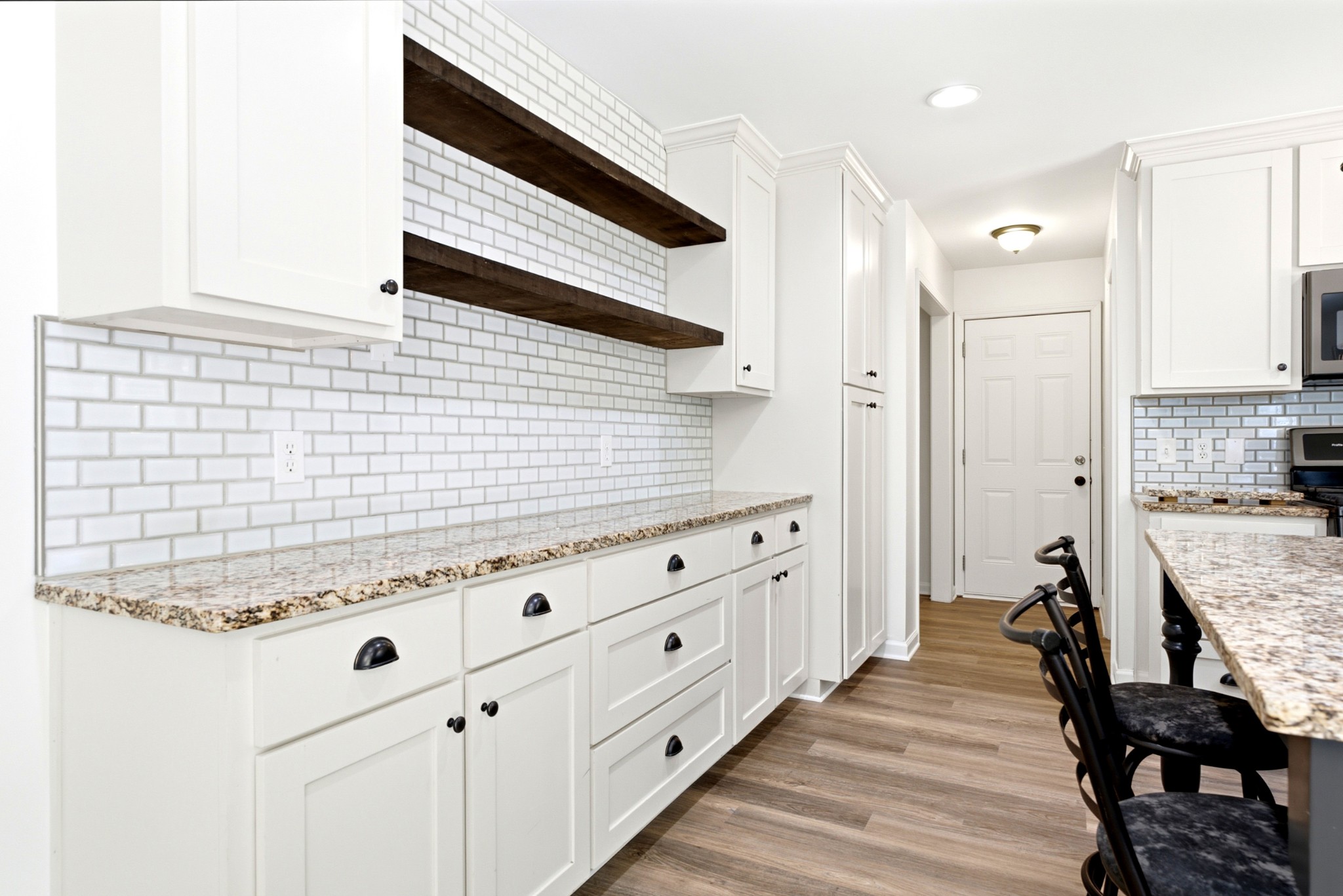 3434 Kinneys Road Cedar Hill, TN 37032 - Photo 33 of 90 a spacious bathroom with a granite countertop double vanity sink a mirror and a shower