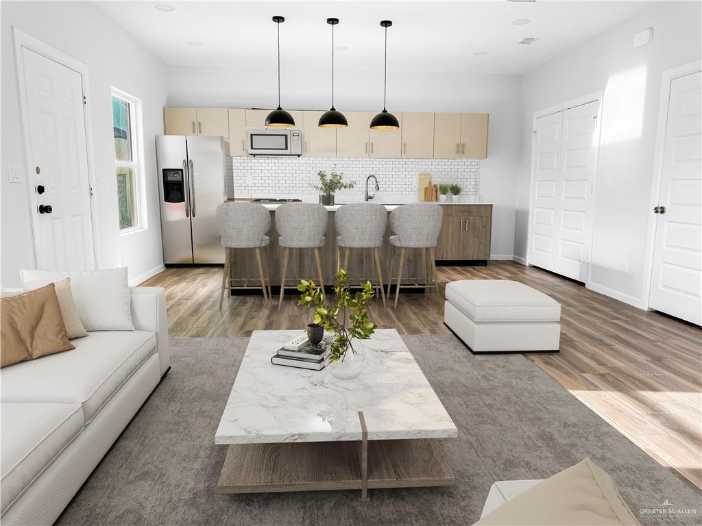 4905 Tyler, Unit 2 McAllen, TX 78503 - Photo 6 of 26 a living room with furniture and wooden floor