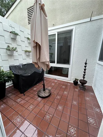 a view of a entryway with flower pots