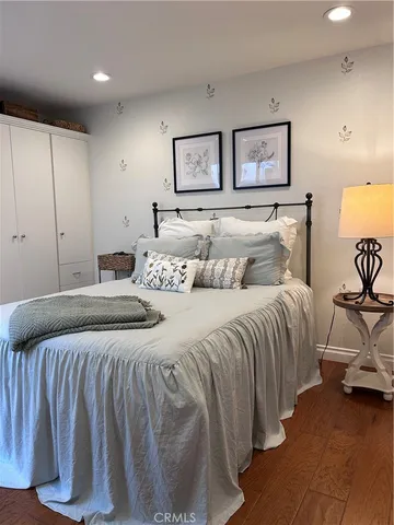 a bedroom with a bed and lamp