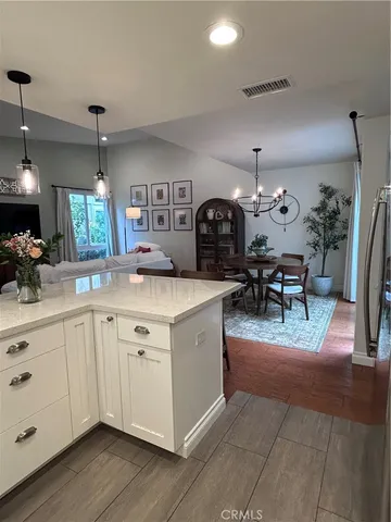 a view of living room with granite countertop furniture and fireplace