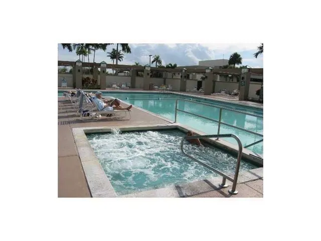 a view of swimming pool with outdoor seating