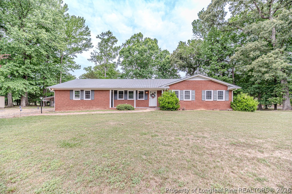 3384 Goldston Glendon Road Goldston, NC 27252 - Photo 5 of 47 a front view of a house with a garden