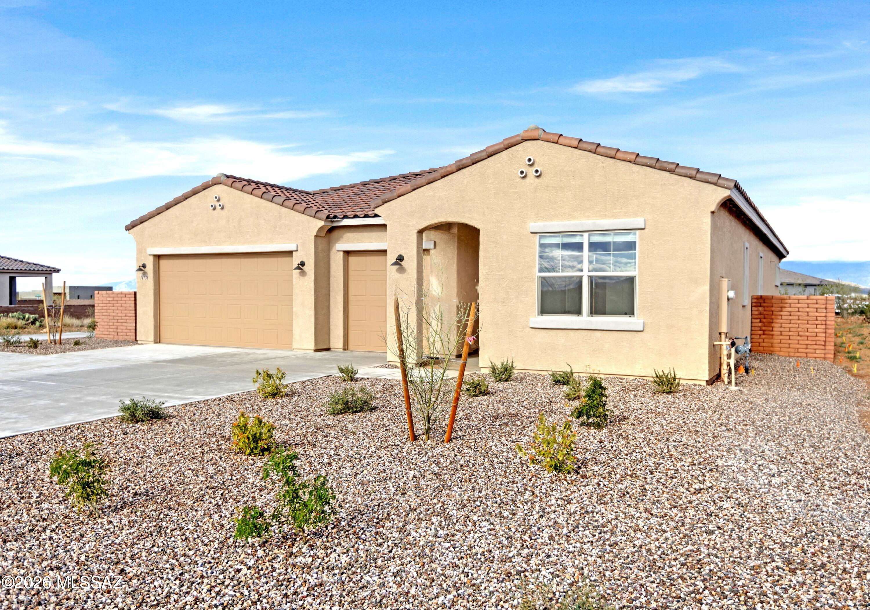 14736 East Sands Ranch Road Vail, AZ 85641 - Photo 17 of 20 a front view of a house with garden