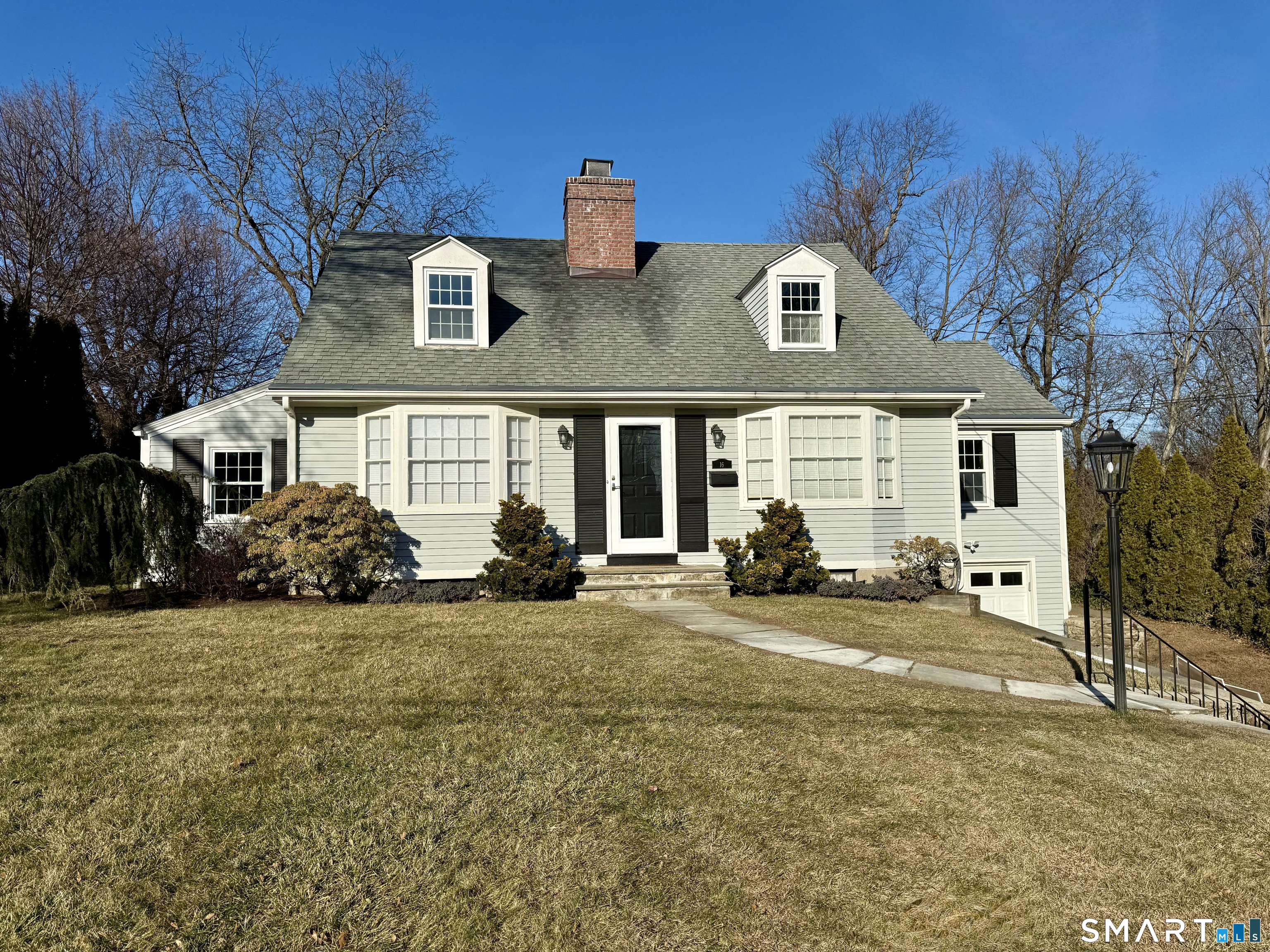 a view of a house with backyard sitting area and garden