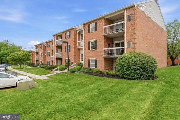 a view of an apartment with a garden