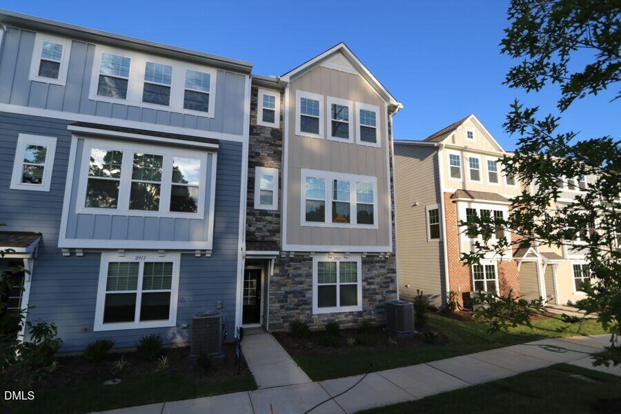 2913 Richardson Road, Unit 475 Apex, NC 27502 - Photo 19 of 24 a front view of a building with garden