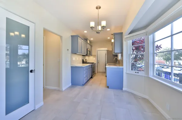a view of a kitchen and a window