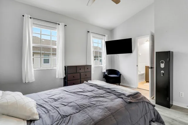 a bathroom with a sink mirror and a shower