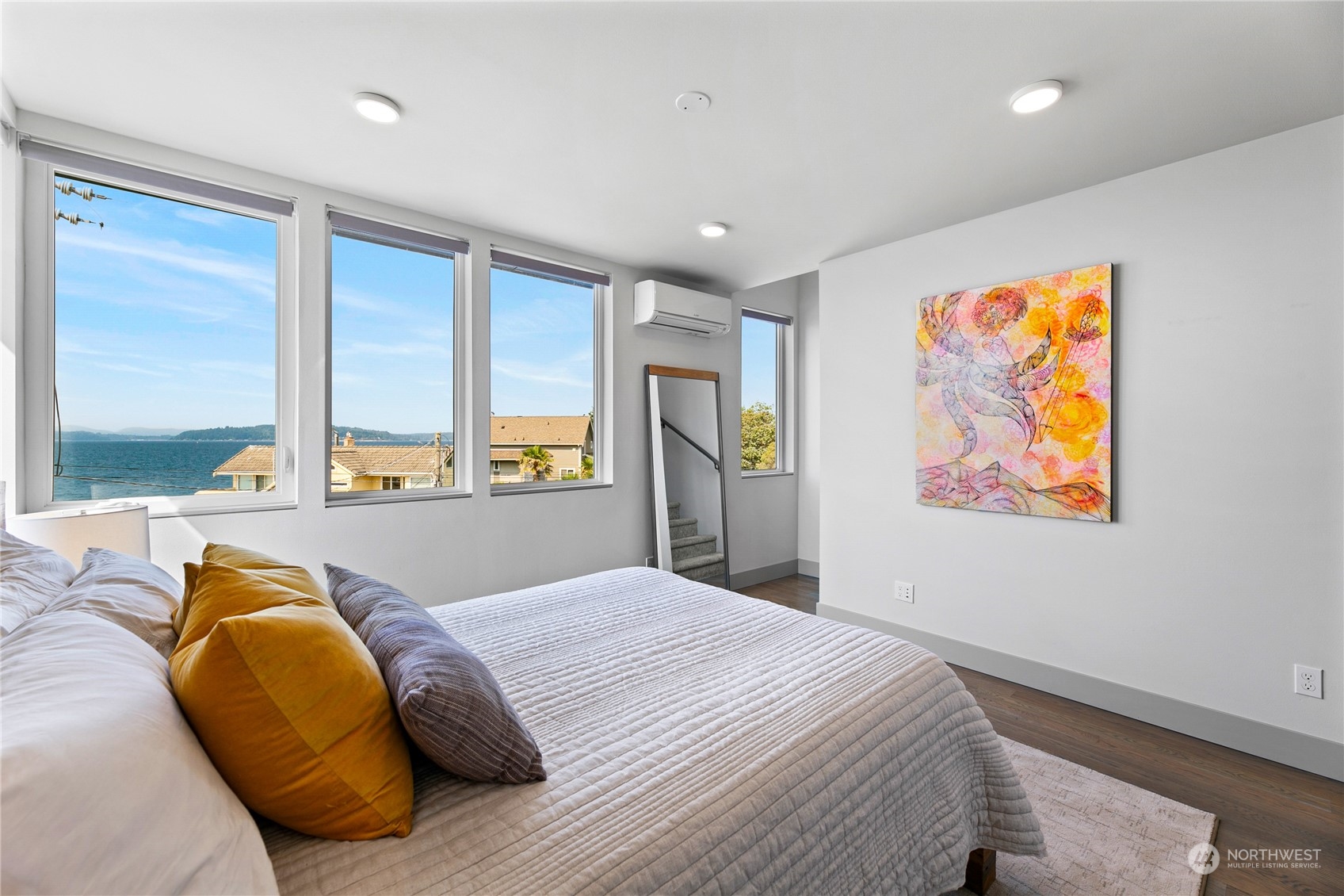 3226 Alki Avenue Southwest Seattle, WA 98116 - Photo 12 of 39 a bed sitting in a bedroom next to a window