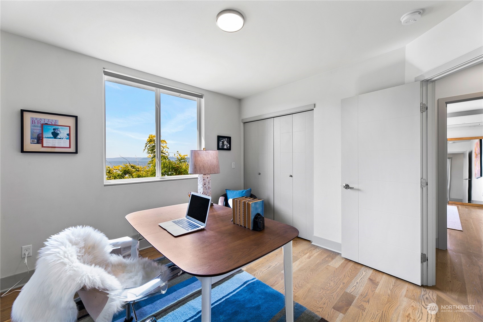 3226 Alki Avenue Southwest Seattle, WA 98116 - Photo 13 of 39 a view of a workspace with furniture and wooden floor