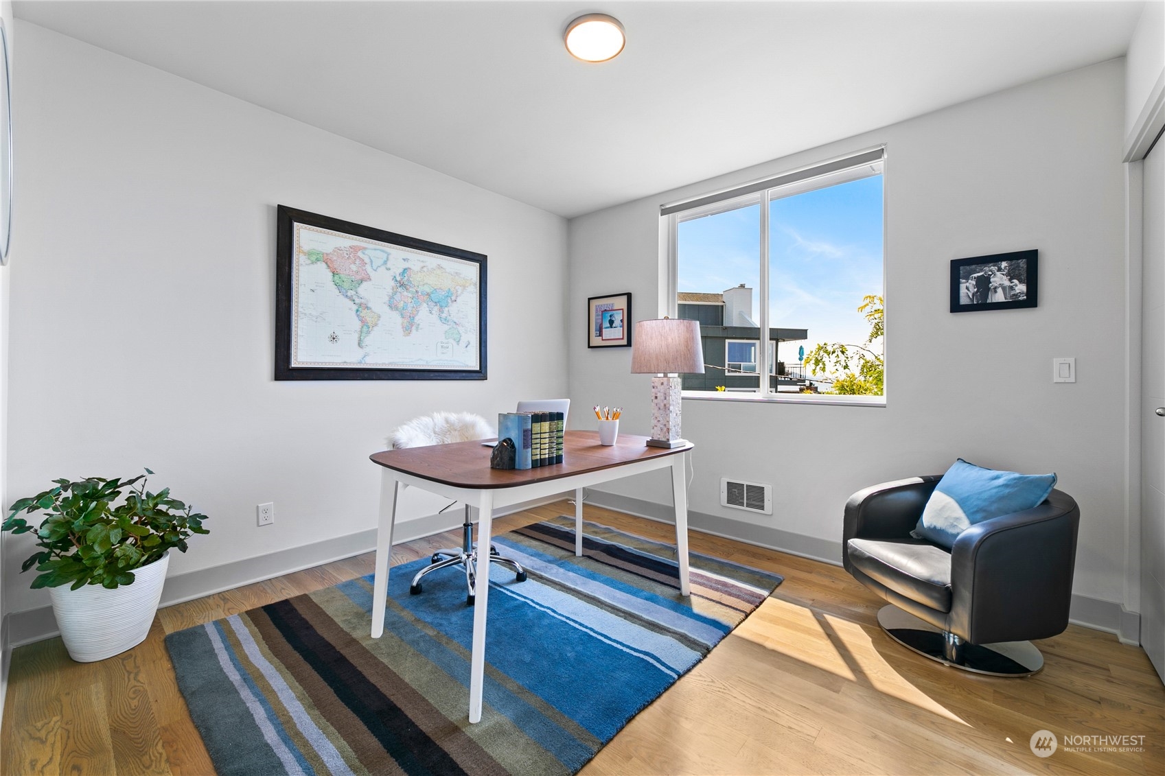 3226 Alki Avenue Southwest Seattle, WA 98116 - Photo 14 of 39 a living room with furniture potted plant and a window