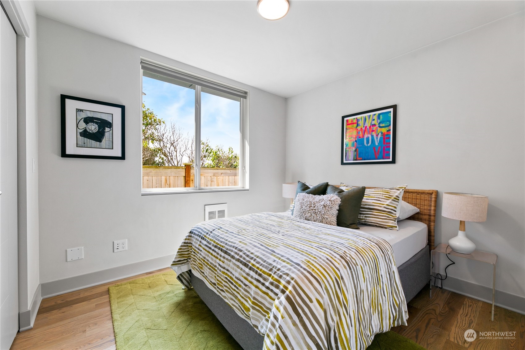3226 Alki Avenue Southwest Seattle, WA 98116 - Photo 16 of 39 a bedroom with a bed and a window