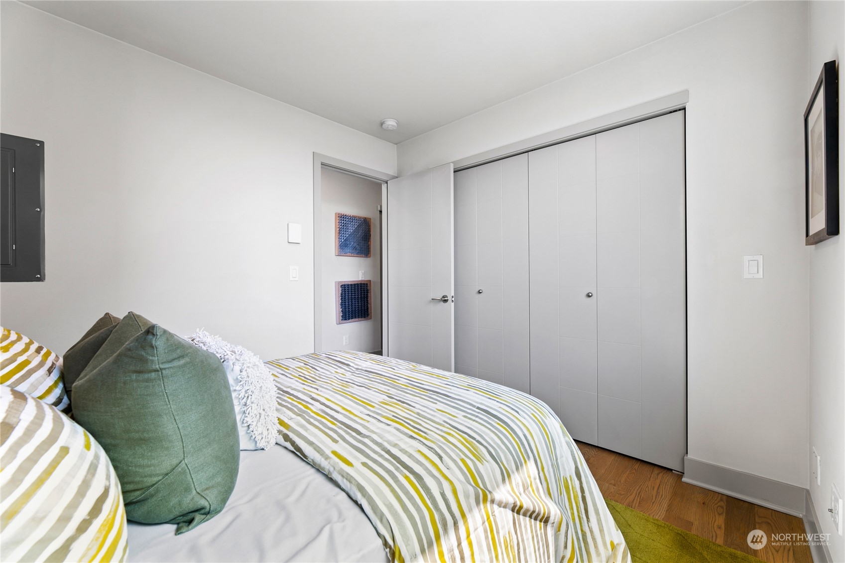 3226 Alki Avenue Southwest Seattle, WA 98116 - Photo 18 of 39 a bedroom with a bed and a painting on the wall