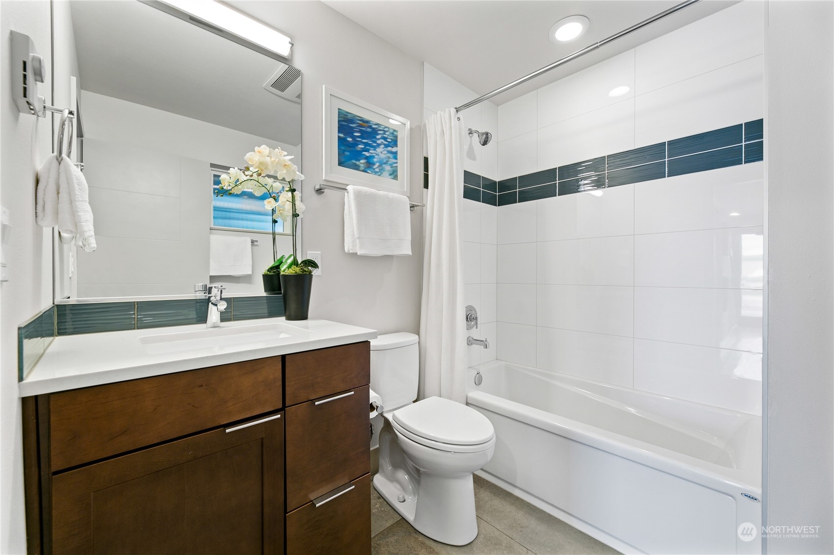3226 Alki Avenue Southwest Seattle, WA 98116 - Photo 19 of 39 a bathroom with a sink a toilet and shower