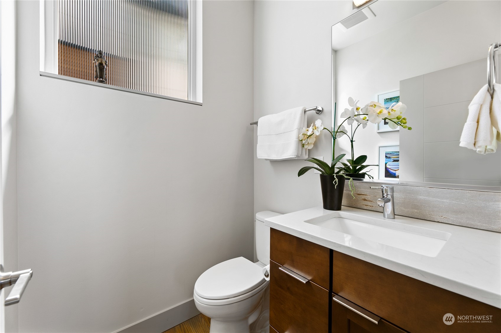 3226 Alki Avenue Southwest Seattle, WA 98116 - Photo 21 of 39 a bathroom with a sink a toilet and with mirror