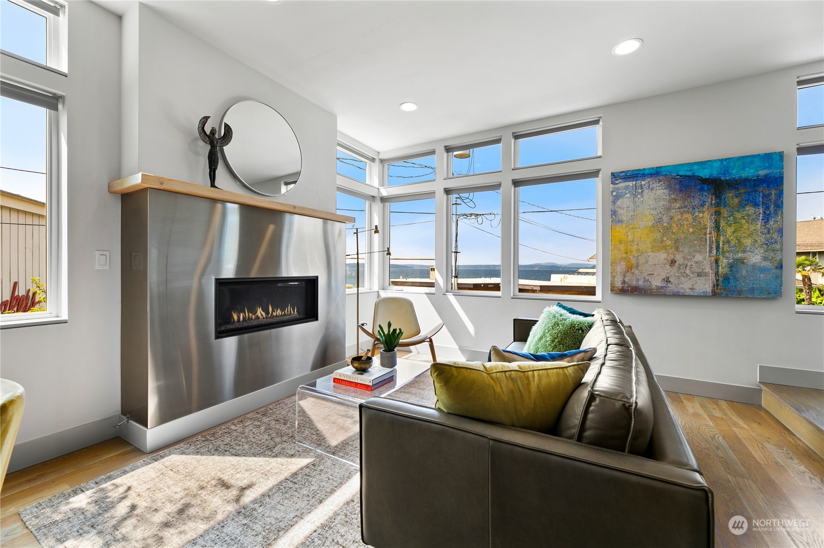 3226 Alki Avenue Southwest Seattle, WA 98116 - Photo 5 of 39 a living room with furniture a rug and a fireplace
