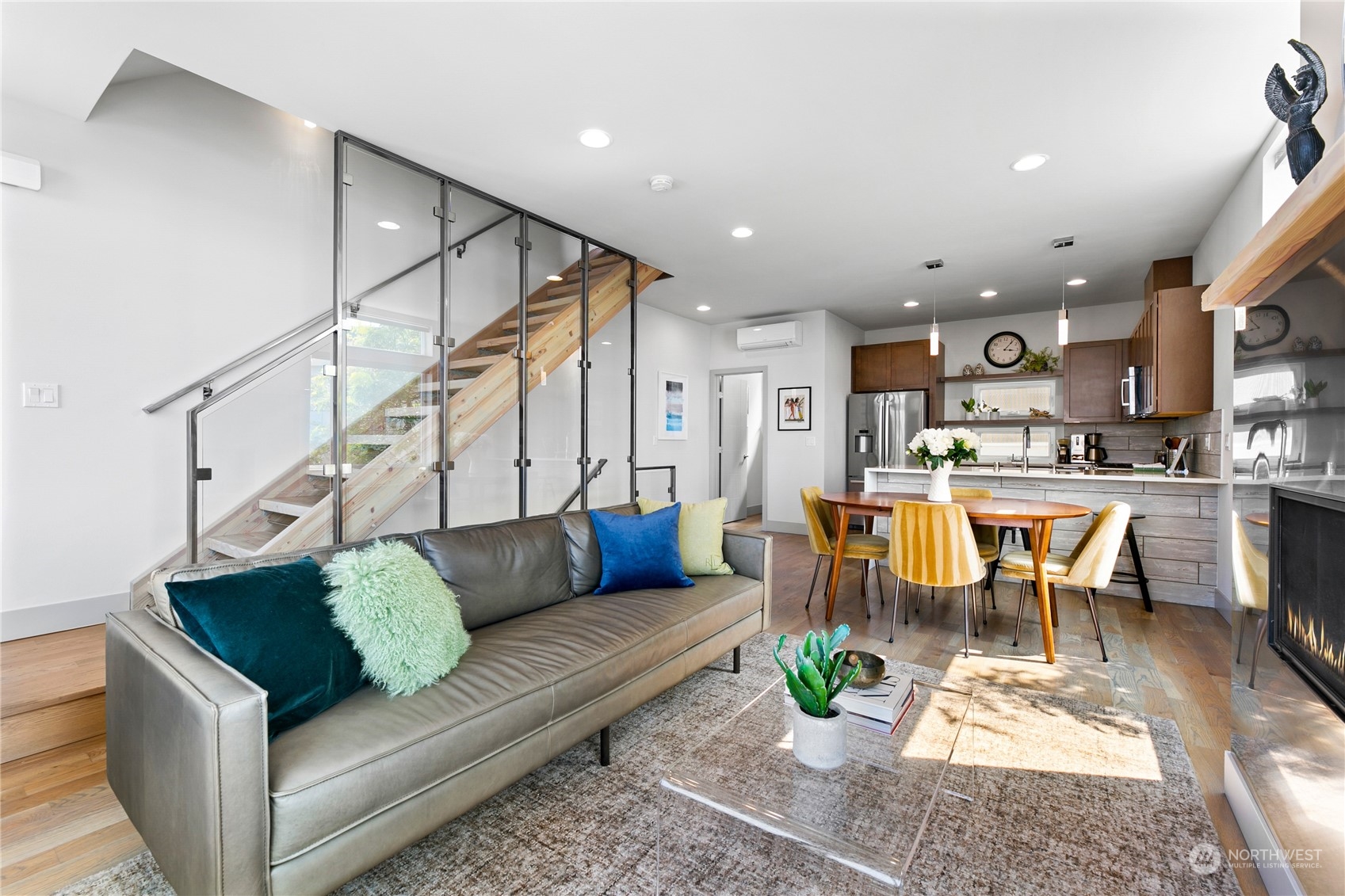 3226 Alki Avenue Southwest Seattle, WA 98116 - Photo 6 of 39 a living room with furniture and a dining table