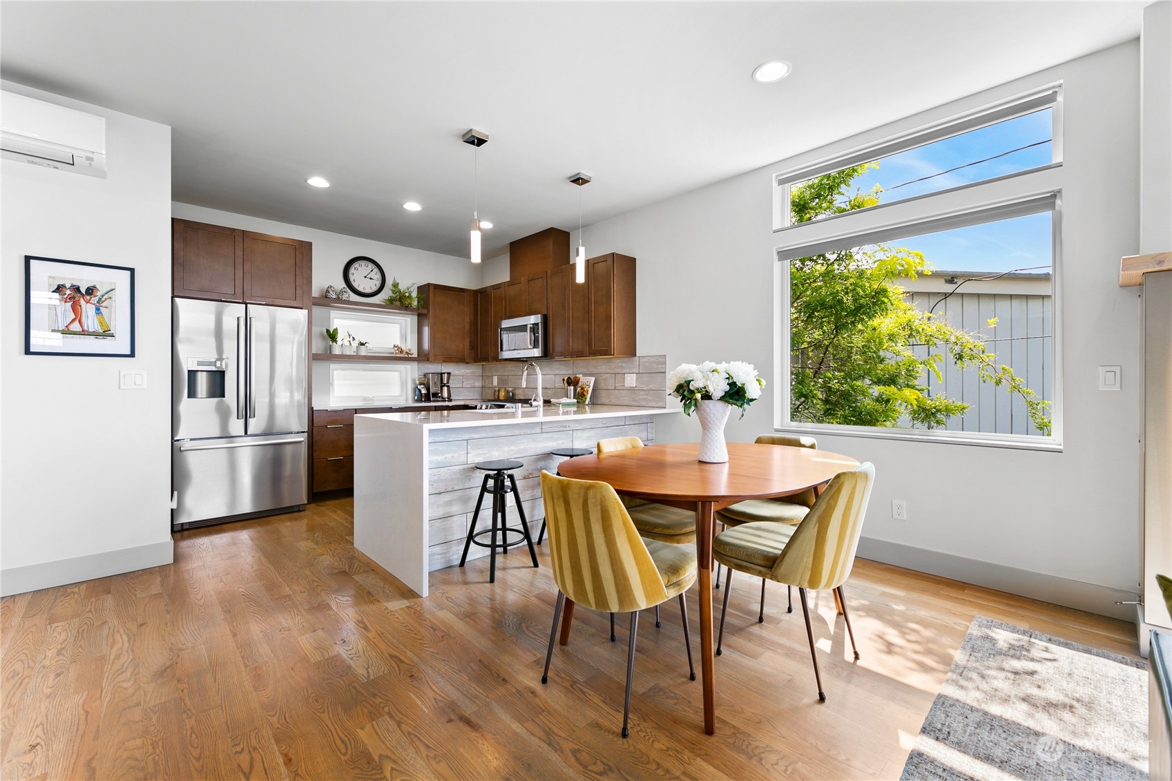 3226 Alki Avenue Southwest Seattle, WA 98116 - Photo 7 of 39 a kitchen with a table and chairs in it