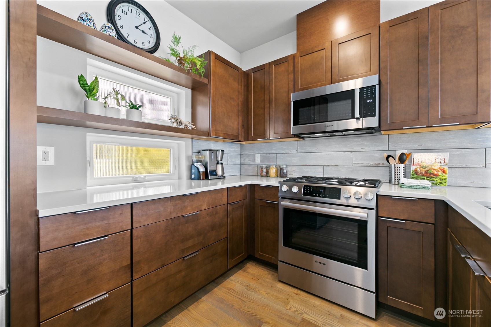 3226 Alki Avenue Southwest Seattle, WA 98116 - Photo 9 of 39 a kitchen with stainless steel appliances granite countertop a stove and a microwave