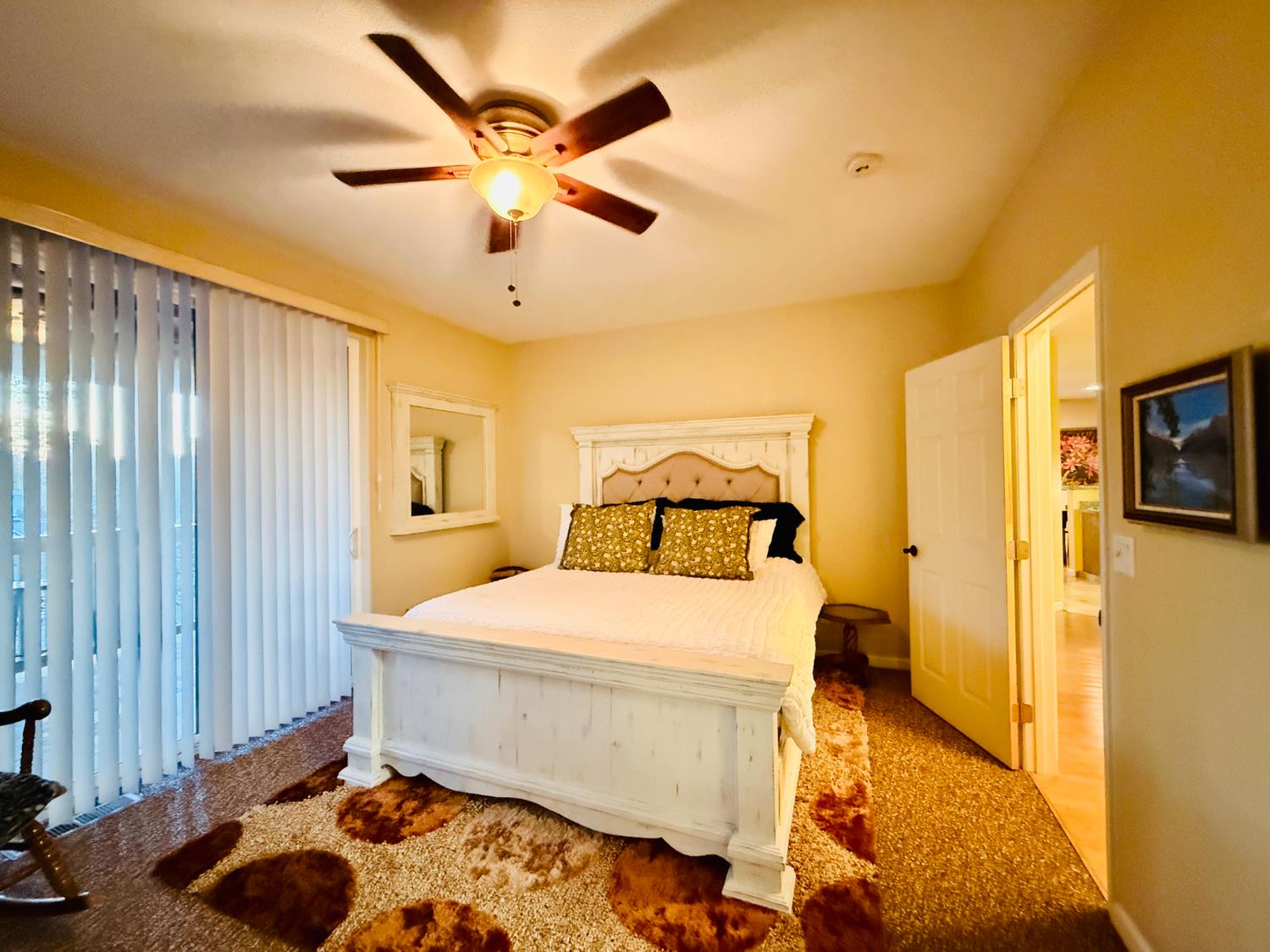 611 Sunrise Road Copperopolis, CA 95228 - Photo 9 of 29 a bedroom with a bed and a chandelier