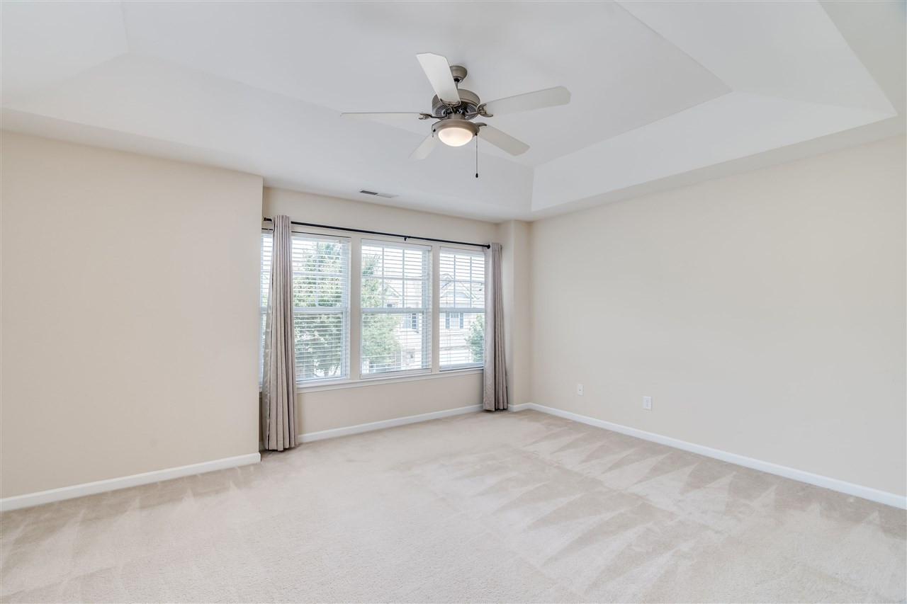 2443 Memory Ridge Drive Raleigh, NC 27606 - Photo 14 of 28 An oversized, bright sunny room features tray celing Owners Suite