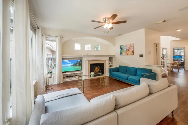 a living room with furniture fireplace and a flat screen tv