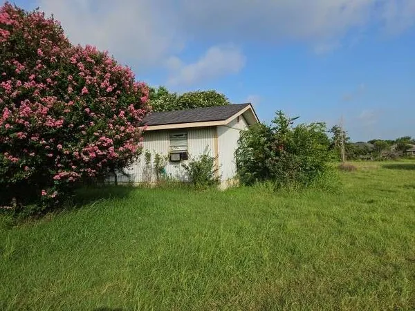 a view of a house with a garden