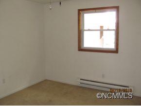 85 Todd Road Clyde, NC 28721 - Photo 8 of 11 an empty room with a window