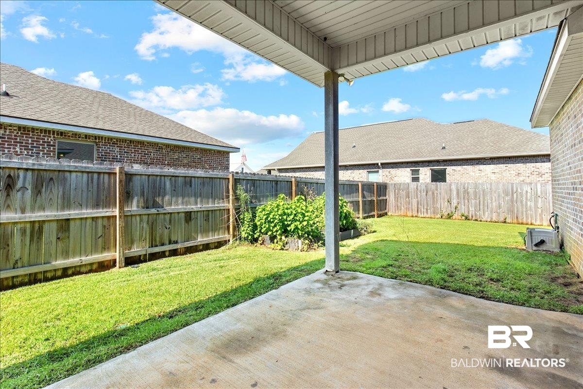 1112 Stella Road Foley, AL 36535 - Photo 21 of 33 Fenced backyard with a patio