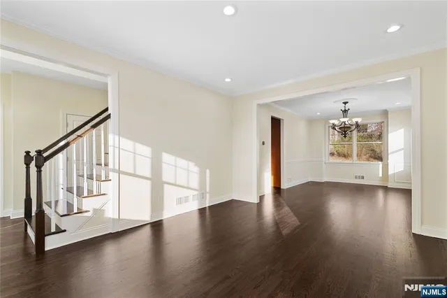 a view of an entryway with wooden floor