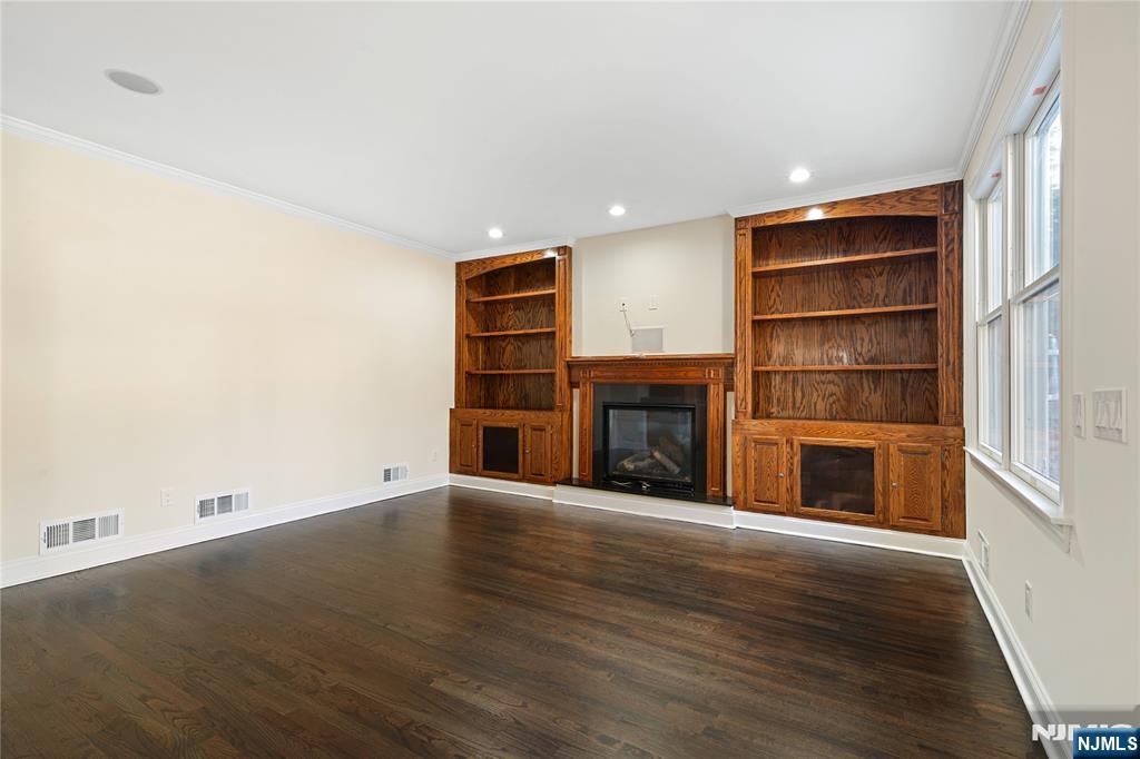 20 Grove Street Boonton, NJ 07005 - Photo 18 of 39 a view of an empty room with a fireplace and a window