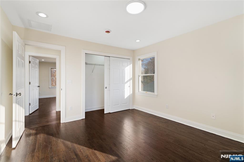 20 Grove Street Boonton, NJ 07005 - Photo 19 of 39 an empty room with wooden floor and windows